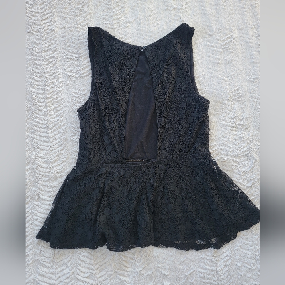 Super cute open back peplum going out top. Sz. M